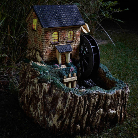 Smart Garden Water Mill Fountain — LED nightlight illuminated in a garden setting