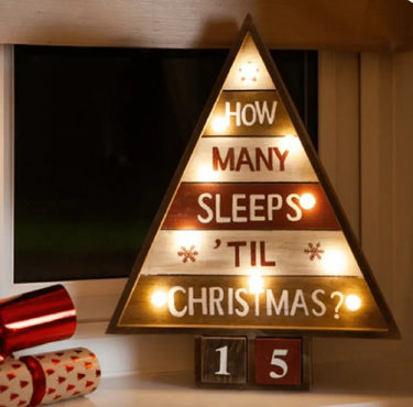 Illuminated wooden tree with “How many sleeps ’til Christmas?” wording and countdown blocks showing 15.